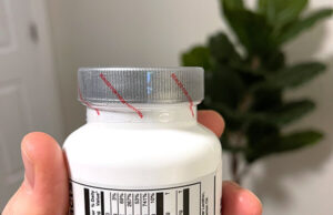supplement bottle with sealed cap - shrink band